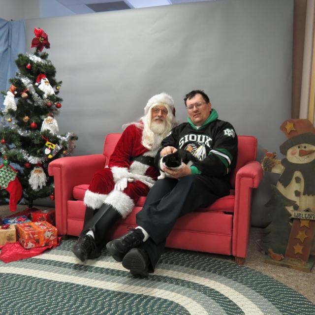 cat and her person with Santa Paws