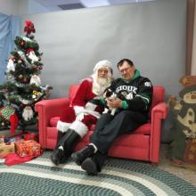 cat and her person with Santa Paws