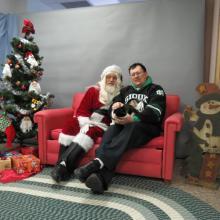 cat and her person with Santa Paws 