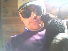 black cat licking human face